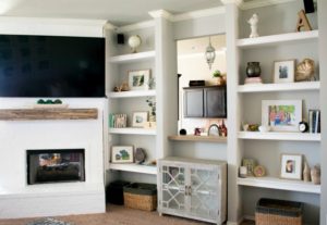 Learn how to paint a brick fireplace with this easy 3 step tutorial. Painted brick fireplace with rustic wood mantle and wall mounted tv, styled built-ins and boho outfit.