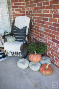 Happy Fall Y'all! Theres no better way to get those pumpkin spice feels than a beautifully decorated fall front porch! See how I decorated our front porch in a way that will carry me through the holidays!