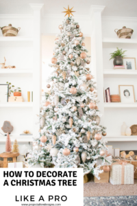 Learn how to decorate a Christmas tree like a pro. This a flocked Christmas tree decorated with black and white ribbon. With gorgeous blush, copper, bronze and gold ornaments.